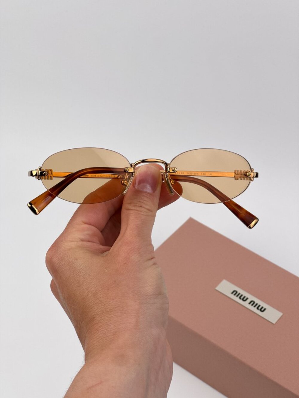 Miu Miu MUA54S 7OE90X Sunglasses – Brass Oval Rimless Metal Frame